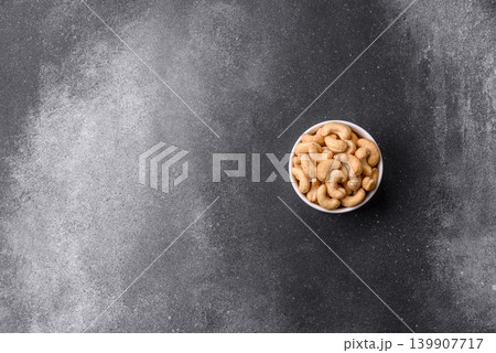 Roasted or raw cashew make a savory snack for a healthy, filling meal. Cashew nuts Roasted or raw cashew make a savory snack for a healthy, filling meal. Cashew nuts 139907717