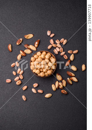 Whole peeled hazelnuts, roasted or raw, as an ingredient for healthy food. Hazelnuts as a background Whole peeled hazelnuts, roasted or raw, as an ingredient for healthy food. Hazelnuts as a background 139907718