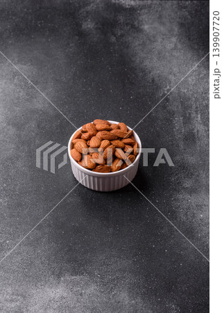 Raw and peeled almonds as a healthy food ingredient. Almonds as a food background Raw and peeled almonds as a healthy food ingredient. Almonds as a food background 139907720