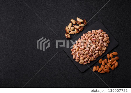 Salted pistachio nuts in shells as a healthy, high calorie food ingredient. Pistachio nuts Salted pistachio nuts in shells as a healthy, high calorie food ingredient. Pistachio nuts 139907721