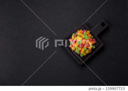 Candied fruit in colorful cubes as an ingredient for baked goods and sweets. Candied fruit 139907723