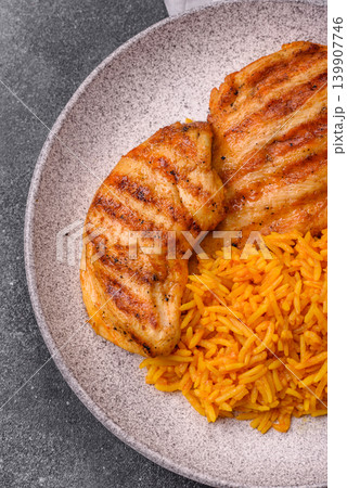 Dajaj Mashwi, an Arabic dish with rice and chicken, salt, and spices. Dajaj Mashwi as a background Dajaj Mashwi, an Arabic dish with rice and chicken, salt, and spices. Dajaj Mashwi as a background 139907746
