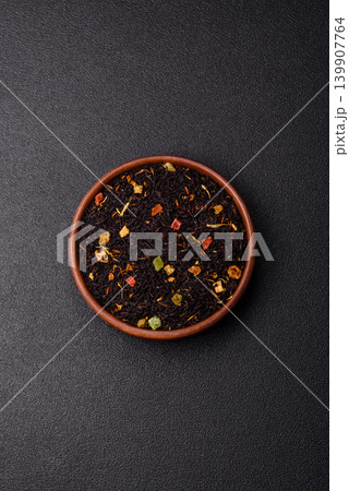 Dry black tea with herbal leaves and aromatic additives. Dry fruity black tea 139907764