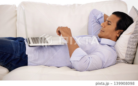 Remote work, laptop and businessman relax on sofa streaming, video or social media at home. Pc, search or freelancer in living room watching online tutorial for elearning, upskill or training course 139908098