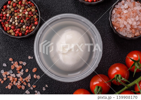 Fresh white burrata cheese with tomatoes for a salad. Burrata cheese Fresh white burrata cheese with tomatoes for a salad. Burrata cheese 139908170