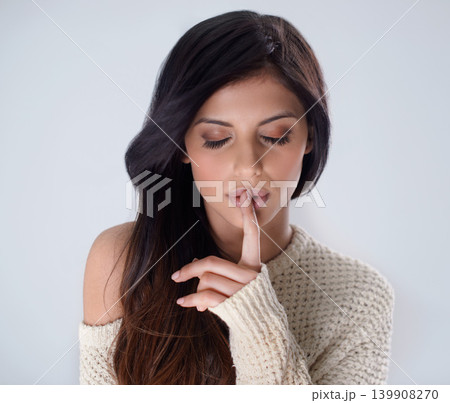 Woman, hair and hands on lips for secret, whisper or confidential information on a studio background. Face of calm female person or model in silence with cotton jersey, makeup or cosmetics on mockup 139908270