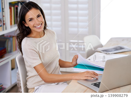 Documents, happy and portrait of woman with laptop working on creative project at home office. Smile, technology and female freelance designer with paperwork and computer in workspace at apartment. 139908279