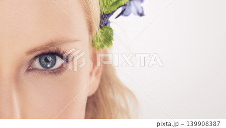 Woman, flowers and half face in studio with beauty, makeup or cosmetics with eyelash extensions on mockup space. Model, person and portrait with collagen, skincare or glowing skin on white background Woman, flowers and half face in studio with beauty, makeup or cosmetics with eyelash extensions on mockup space. Model, person and portrait with collagen, skincare or glowing skin on white background 139908387