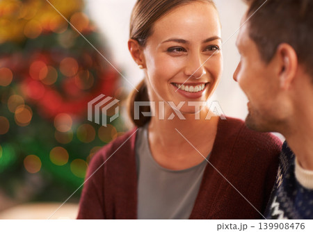 Smile, conversation and couple on a date on Christmas for romantic, holidays and love bonding. Happy, care and young man and woman talking in living room with xmas festive decoration at home. 139908476