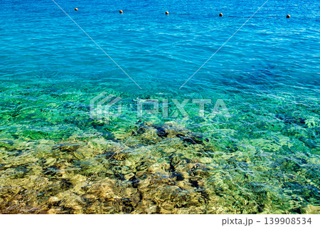 clear water in the sea and buoys on the surface clear water in the sea and buoys on the surface 139908534