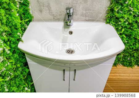 white hand-washing sink in bathroom 139908568