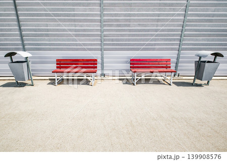 benches and bins in recreation area in parking lot 139908576