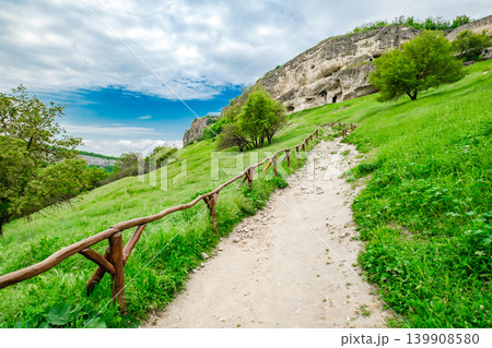 hiking trail with wooden railings in the mountains hiking trail with wooden railings in the mountains 139908580