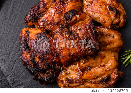 Chicken or turkey, poultry breast baked on the grill or barbecue. Grilled chicken Chicken or turkey, poultry breast baked on the grill or barbecue. Grilled chicken 139908766