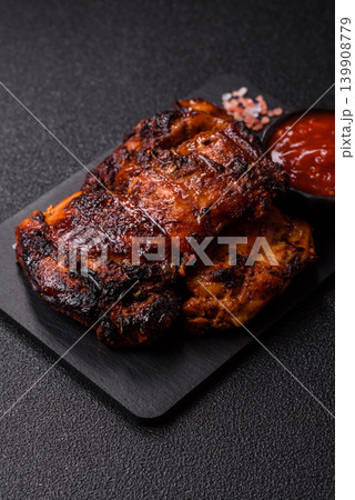 Chicken or turkey, poultry breast baked on the grill or barbecue. Grilled chicken Chicken or turkey, poultry breast baked on the grill or barbecue. Grilled chicken 139908779