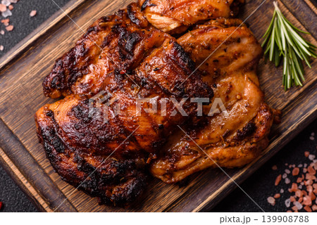 Chicken or turkey, poultry breast baked on the grill or barbecue. Grilled chicken Chicken or turkey, poultry breast baked on the grill or barbecue. Grilled chicken 139908788