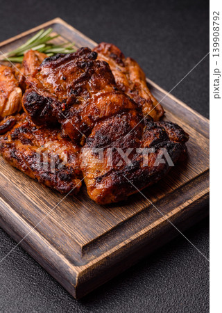 Chicken or turkey, poultry breast baked on the grill or barbecue. Grilled chicken Chicken or turkey, poultry breast baked on the grill or barbecue. Grilled chicken 139908792