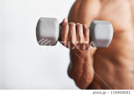 Closeup, hand and man with dumbbell, exercise and weights training for wellness and endurance. Person, bodybuilder and guy with equipment and progress with fitness and strong with health and energy Closeup, hand and man with dumbbell, exercise and weights training for wellness and endurance. Person, bodybuilder and guy with equipment and progress with fitness and strong with health and energy 139909081