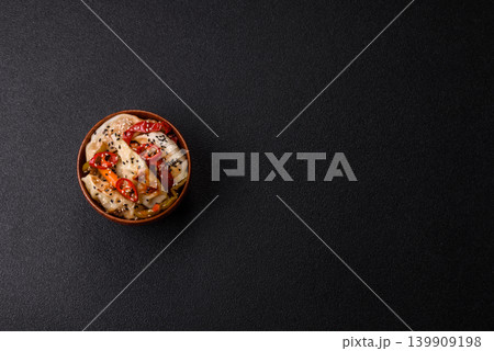 Gyoza, Chinese or Japanese meat dumplings, is an Asian food with hot peppers. Gyoza with meat 139909198
