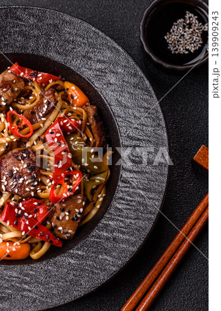 Food, Chinese or Japanese noodles with meat, vegetables, and spices. Noodles with beef Food, Chinese or Japanese noodles with meat, vegetables, and spices. Noodles with beef 139909243