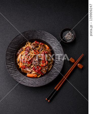 Food, Chinese or Japanese noodles with meat, vegetables, and spices. Noodles with beef Food, Chinese or Japanese noodles with meat, vegetables, and spices. Noodles with beef 139909247