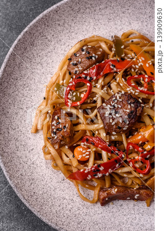 Food, Chinese or Japanese noodles with meat, vegetables, and spices. Noodles with beef Food, Chinese or Japanese noodles with meat, vegetables, and spices. Noodles with beef 139909630
