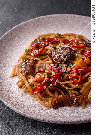 Food, Chinese or Japanese noodles with meat, vegetables, and spices. Noodles with beef Food, Chinese or Japanese noodles with meat, vegetables, and spices. Noodles with beef 139909631