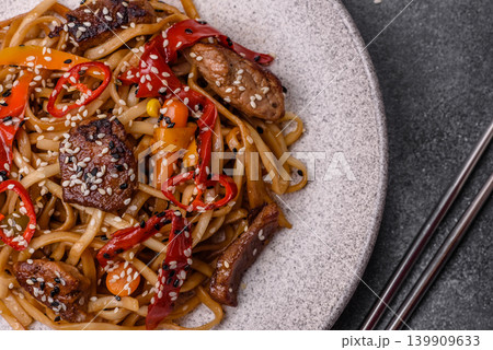 Food, Chinese or Japanese noodles with meat, vegetables, and spices. Noodles with beef Food, Chinese or Japanese noodles with meat, vegetables, and spices. Noodles with beef 139909633