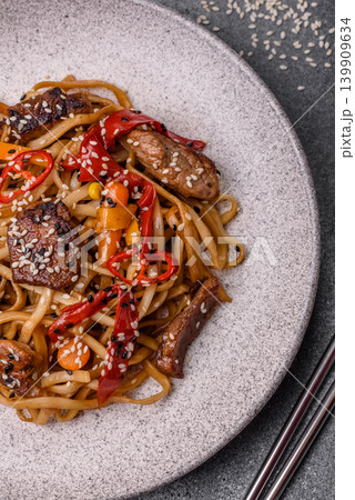 Food, Chinese or Japanese noodles with meat, vegetables, and spices. Noodles with beef Food, Chinese or Japanese noodles with meat, vegetables, and spices. Noodles with beef 139909634