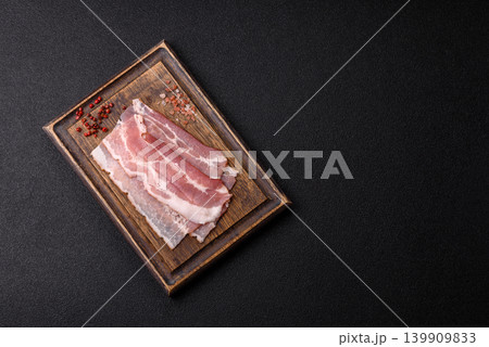 Raw fresh bacon slices with layers of meat or prosciutto with salt and spices. Raw bacon 139909833