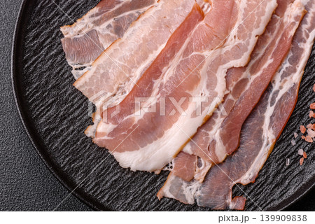Raw fresh bacon slices with layers of meat or prosciutto with salt and spices. Raw bacon 139909838