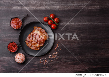Fried fresh bacon slices with layers of meat or prosciutto with salt and spices. Fried bacon Fried fresh bacon slices with layers of meat or prosciutto with salt and spices. Fried bacon 139909873