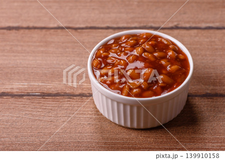 Beans in tomato sauce, a canned stew for the dinner table. Beans in tomato sauce Beans in tomato sauce, a canned stew for the dinner table. Beans in tomato sauce 139910158