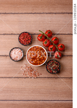Beans in tomato sauce, a canned stew for the dinner table. Beans in tomato sauce Beans in tomato sauce, a canned stew for the dinner table. Beans in tomato sauce 139910164