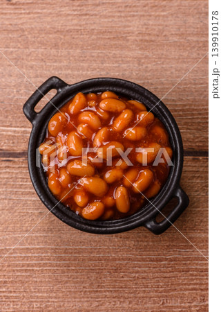 Beans in tomato sauce, a canned stew for the dinner table. Beans in tomato sauce Beans in tomato sauce, a canned stew for the dinner table. Beans in tomato sauce 139910178