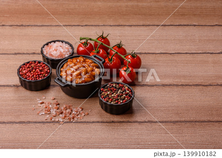 Beans in tomato sauce, a canned stew for the dinner table. Beans in tomato sauce Beans in tomato sauce, a canned stew for the dinner table. Beans in tomato sauce 139910182