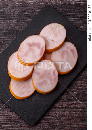 Slices of cooked chicken sausage for sandwiches and antipasto for dinner. Sausage slices 139910188