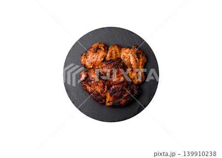 Chicken or turkey, poultry breast baked on the grill or barbecue. Grilled chicken Chicken or turkey, poultry breast baked on the grill or barbecue. Grilled chicken 139910238