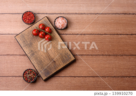 Empty wooden cutting board for preparing ingredients for home cooking. An empty cutting board Empty wooden cutting board for preparing ingredients for home cooking. An empty cutting board 139910270