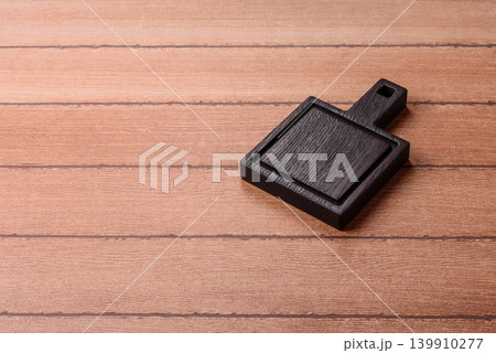 Empty wooden cutting board for preparing ingredients for home cooking. An empty cutting board 139910277