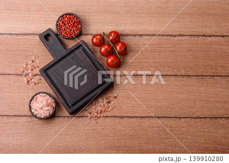 Empty wooden cutting board for preparing ingredients for home cooking. An empty cutting board 139910280