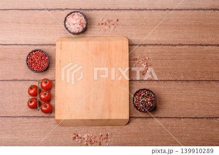 Empty wooden cutting board for preparing ingredients for home cooking. An empty cutting board Empty wooden cutting board for preparing ingredients for home cooking. An empty cutting board 139910289