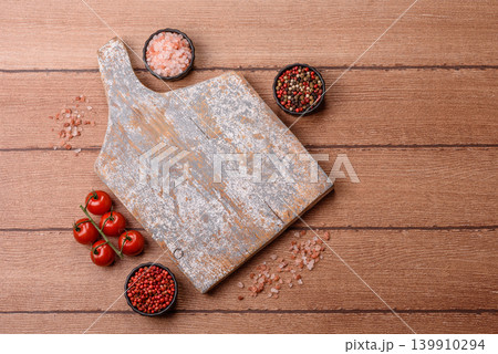 Empty wooden cutting board for preparing ingredients for home cooking. An empty cutting board Empty wooden cutting board for preparing ingredients for home cooking. An empty cutting board 139910294