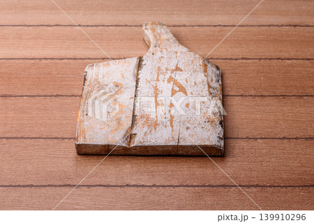 Empty wooden cutting board for preparing ingredients for home cooking. An empty cutting board Empty wooden cutting board for preparing ingredients for home cooking. An empty cutting board 139910296