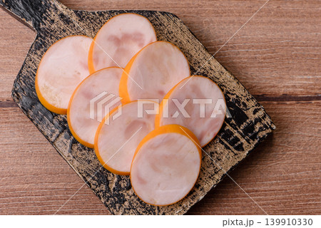 Slices of cooked chicken sausage for sandwiches and antipasto for dinner. Sausage slices Slices of cooked chicken sausage for sandwiches and antipasto for dinner. Sausage slices 139910330