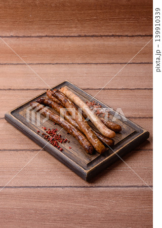 Thin chicken or pork sausages grilled or barbecued. Grilled sausages Thin chicken or pork sausages grilled or barbecued. Grilled sausages 139910339