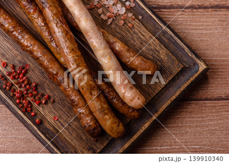 Thin chicken or pork sausages grilled or barbecued. Grilled sausages Thin chicken or pork sausages grilled or barbecued. Grilled sausages 139910340