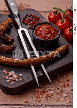 Thin chicken or pork sausages grilled or barbecued. Grilled sausages Thin chicken or pork sausages grilled or barbecued. Grilled sausages 139910350