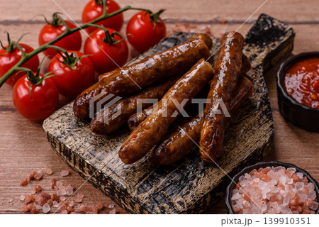 Thin chicken or pork sausages grilled or barbecued. Grilled sausages Thin chicken or pork sausages grilled or barbecued. Grilled sausages 139910351