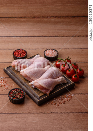 Fresh raw chicken or turkey legs for diet food. Raw chicken legs 139910371
